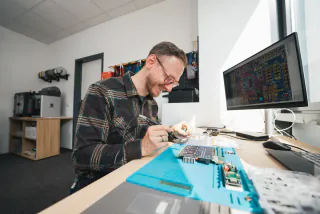 Developer working on a circuit board